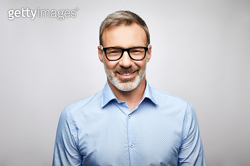 Close-up smiling male leader wearing eyeglasses - gettyimageskorea
