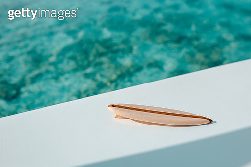 High Angle View Of Small Surfboard Against Swimming Pool - gettyimageskorea
