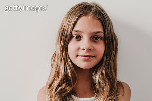 Portrait Of Smiling Girl Against White Background - gettyimageskorea