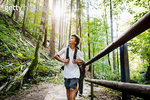 Young Boy Enjoying The View While Hiking - gettyimageskorea