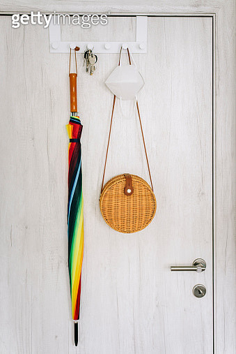Protective face masks hanging on coat hanger - gettyimageskorea